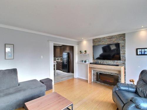 Overall view - 217 Boul. Dennison, Val-D'Or, QC - Indoor Photo Showing Living Room With Fireplace