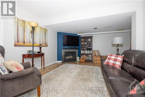 4352 Wildmint Square, Ottawa, ON - Indoor Photo Showing Living Room With Fireplace