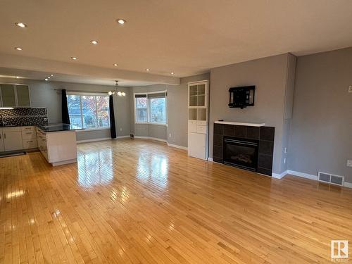 11231 75 Av Nw, Edmonton, AB - Indoor Photo Showing Living Room With Fireplace