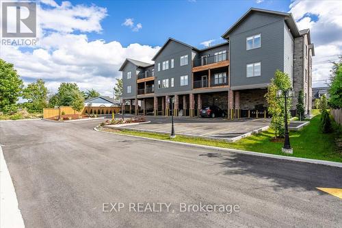 201 - 163 Port Robinson Road, Welland, ON - Outdoor With Balcony With Facade