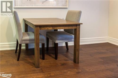 Unfurnished dining area featuring dark wood-type flooring - 1869 Muskoka Road 118 W Unit# L204-D2, Muskoka Lakes, ON - Indoor Photo Showing Dining Room