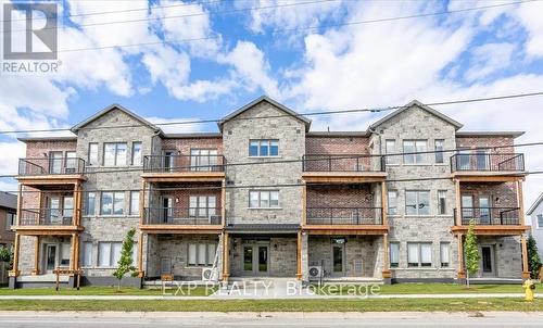 102 - 163 Port Robinson Road, Pelham, ON - Outdoor With Balcony With Facade