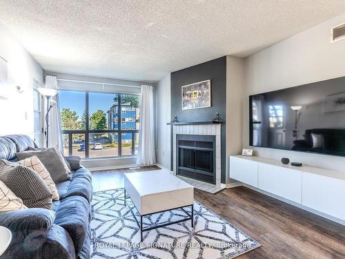 215-126 Bell Farm Rd, Barrie, ON - Indoor Photo Showing Living Room With Fireplace