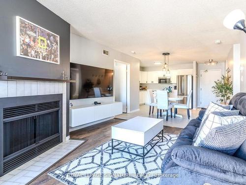 215-126 Bell Farm Rd, Barrie, ON - Indoor Photo Showing Living Room With Fireplace