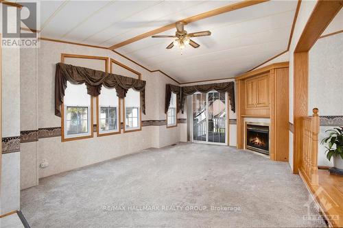 14 Yvette, Ottawa, ON - Indoor Photo Showing Other Room With Fireplace