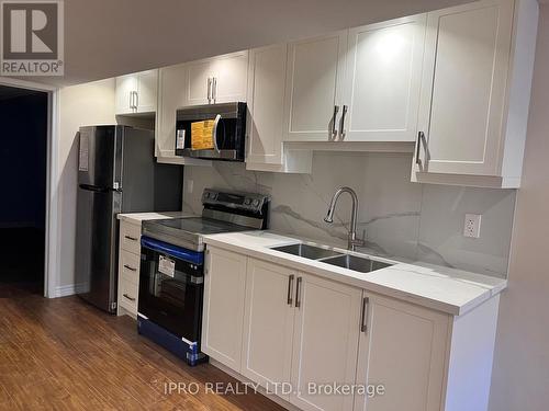 3914 Stardust Drive, Mississauga, ON - Indoor Photo Showing Kitchen With Double Sink