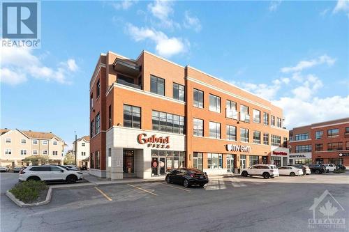 Retail Plaza across the street on Kennevale Dr - 223 Kennevale Drive, Ottawa, ON - Outdoor With Facade