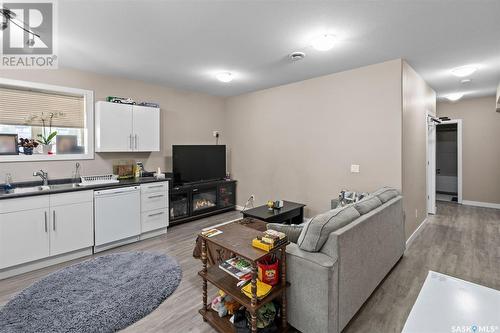 710 Rosewood Boulevard W, Saskatoon, SK - Indoor Photo Showing Kitchen With Fireplace With Double Sink