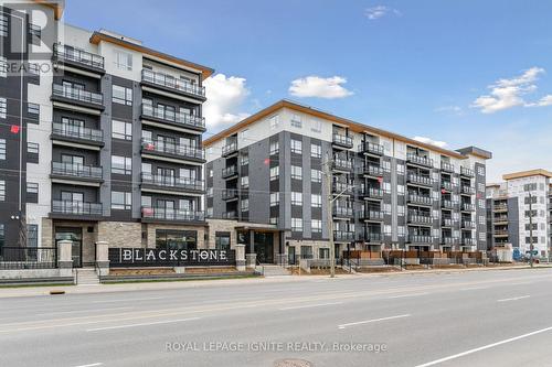 201 - 243 Northfield Drive E, Waterloo, ON - Outdoor With Balcony With Facade