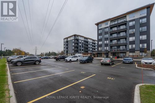 201 - 243 Northfield Drive E, Waterloo, ON - Outdoor With Balcony With Facade