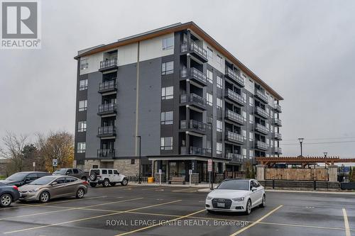 201 - 243 Northfield Drive E, Waterloo, ON - Outdoor With Balcony With Facade