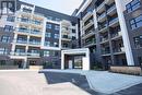 208 - 128 Grovewood Common, Oakville, ON  - Outdoor With Facade 