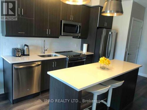 208 - 128 Grovewood Common, Oakville, ON - Indoor Photo Showing Kitchen With Stainless Steel Kitchen With Upgraded Kitchen