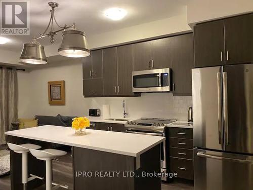 208 - 128 Grovewood Common, Oakville, ON - Indoor Photo Showing Kitchen With Stainless Steel Kitchen With Upgraded Kitchen