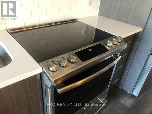 208 - 128 Grovewood Common, Oakville, ON - Indoor Photo Showing Kitchen