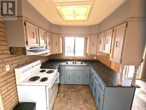 210 3Rd Street S, Martensville, SK - Indoor Photo Showing Kitchen With Double Sink