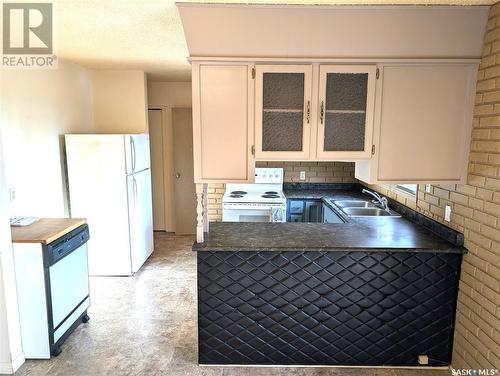 210 3Rd Street S, Martensville, SK - Indoor Photo Showing Kitchen With Double Sink