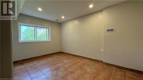 Empty room with tile patterned floors - 406 Erb Street W Unit# 2, Waterloo, ON - Indoor Photo Showing Other Room