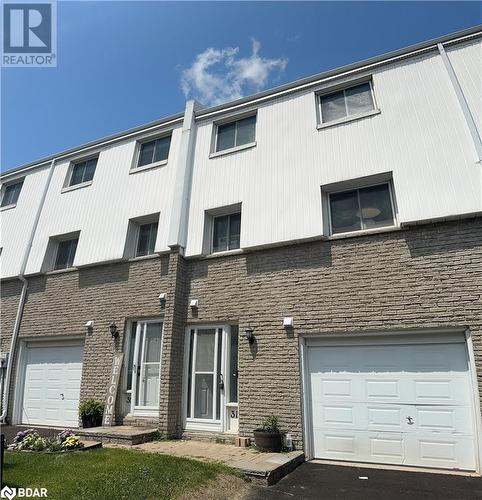 View of property featuring a garage - 325 William Williams Street Unit# 31, Shelburne, ON - Outdoor