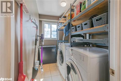 Washroom with washer and dryer and light tile patterned floors - 325 William Williams Street Unit# 31, Shelburne, ON - Indoor Photo Showing Laundry Room