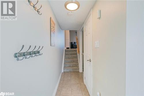 Hallway featuring a textured ceiling and light tile patterned floors - 325 William Williams Street Unit# 31, Shelburne, ON - Indoor Photo Showing Other Room