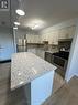 125 - 1050 Stainton Drive, Mississauga, ON  - Indoor Photo Showing Kitchen With Double Sink 