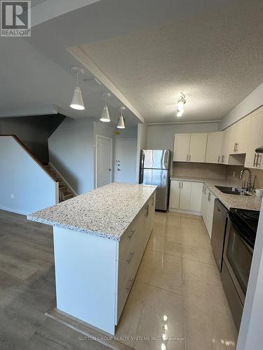 125 - 1050 Stainton Drive, Mississauga, ON - Indoor Photo Showing Kitchen With Double Sink