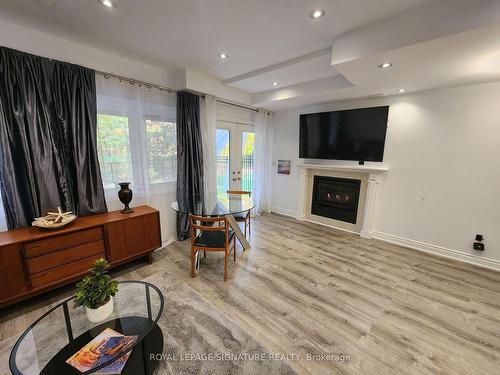 Bsmt-2370 Chateau Common St, Oakville, ON - Indoor Photo Showing Living Room With Fireplace