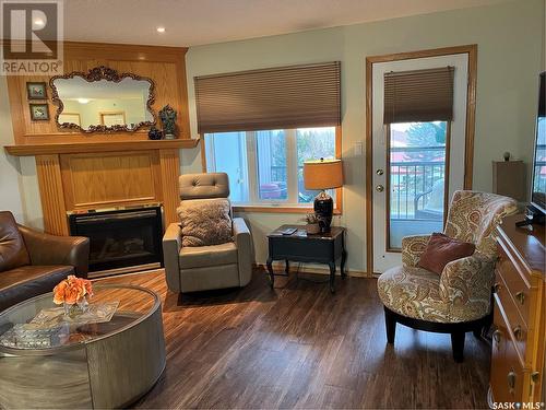 402 2930 Arens Road E, Regina, SK - Indoor Photo Showing Living Room With Fireplace