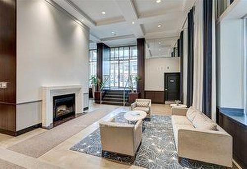 425-900 Mount Pleasant Rd, Toronto, ON - Indoor Photo Showing Living Room With Fireplace