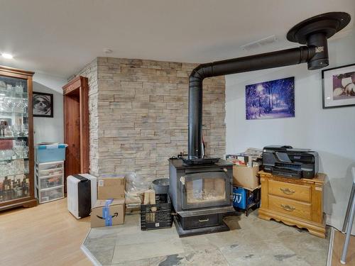 Basement - 2860 Rue Des Harles, Terrebonne (La Plaine), QC - Indoor With Fireplace