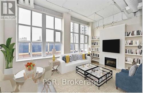 216 - 404 King Street W, Kitchener, ON - Indoor Photo Showing Living Room With Fireplace