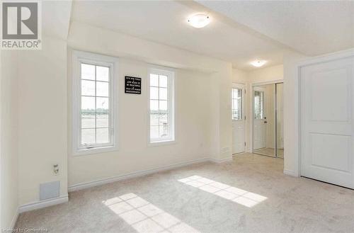 View of carpeted spare room - 88 Decorso Drive Unit# 44, Guelph, ON - Indoor Photo Showing Other Room