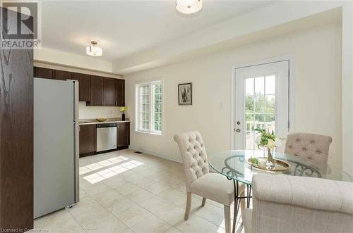 Dining area featuring a wealth of natural light and light tile patterned flooring - 88 Decorso Drive Unit# 44, Guelph, ON - Indoor Photo Showing Other Room