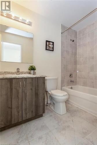 Full bathroom with vanity, tiled shower / bath, and toilet - 88 Decorso Drive Unit# 44, Guelph, ON - Indoor Photo Showing Bathroom