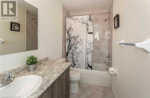 Full bathroom featuring vanity, shower / bathtub combination with curtain, and toilet - 88 Decorso Drive Unit# 44, Guelph, ON - Indoor Photo Showing Bathroom