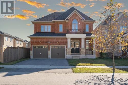 View of front facade featuring a garage and a front yard - 1174 Upper Thames Drive, Woodstock, ON - Outdoor With Facade