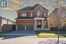 View of front facade featuring a garage and a front yard - 1174 Upper Thames Drive, Woodstock, ON  - Outdoor With Facade 