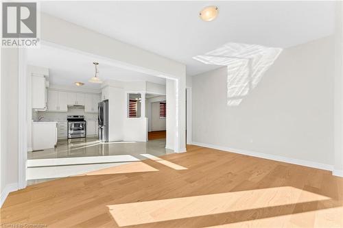 Unfurnished living room featuring light hardwood / wood-style floors and sink - 1174 Upper Thames Drive, Woodstock, ON - Indoor Photo Showing Other Room