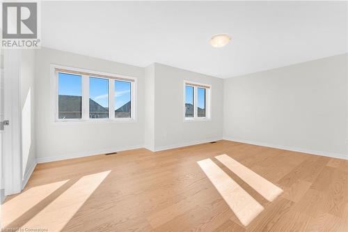 Empty room featuring light wood-type flooring - 1174 Upper Thames Drive, Woodstock, ON - Indoor Photo Showing Other Room