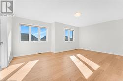 Empty room featuring light wood-type flooring - 