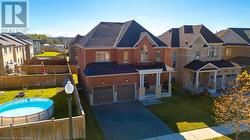 View of front of home with a front lawn and a garage - 