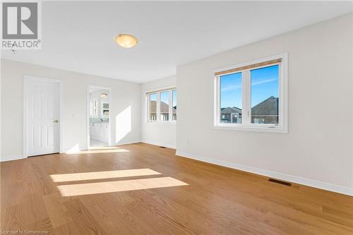 Unfurnished living room with light hardwood / wood-style flooring - 1174 Upper Thames Drive, Woodstock, ON - Indoor Photo Showing Other Room