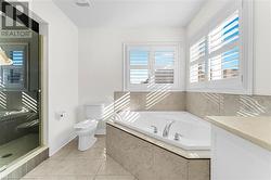 Full bathroom with vanity, toilet, and plus walk in shower - 