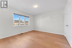 Empty room with light hardwood / wood-style floors - 