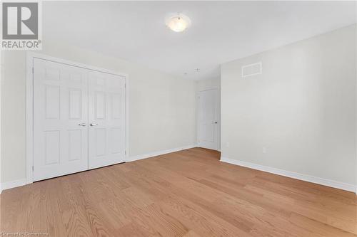 Unfurnished bedroom with a closet and light hardwood / wood-style floors - 1174 Upper Thames Drive, Woodstock, ON - Indoor Photo Showing Other Room