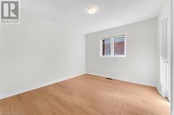 Empty room featuring light hardwood / wood-style floors - 