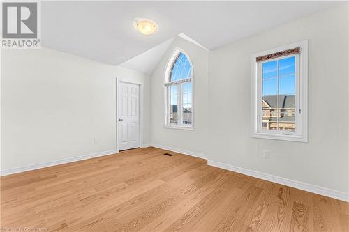 Unfurnished room with light wood-type flooring and vaulted ceiling - 1174 Upper Thames Drive, Woodstock, ON - Indoor Photo Showing Other Room