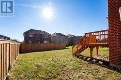 View of yard featuring a wooden deck - 