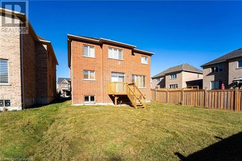 Back of house featuring a yard - 1174 Upper Thames Drive, Woodstock, ON - Outdoor With Exterior